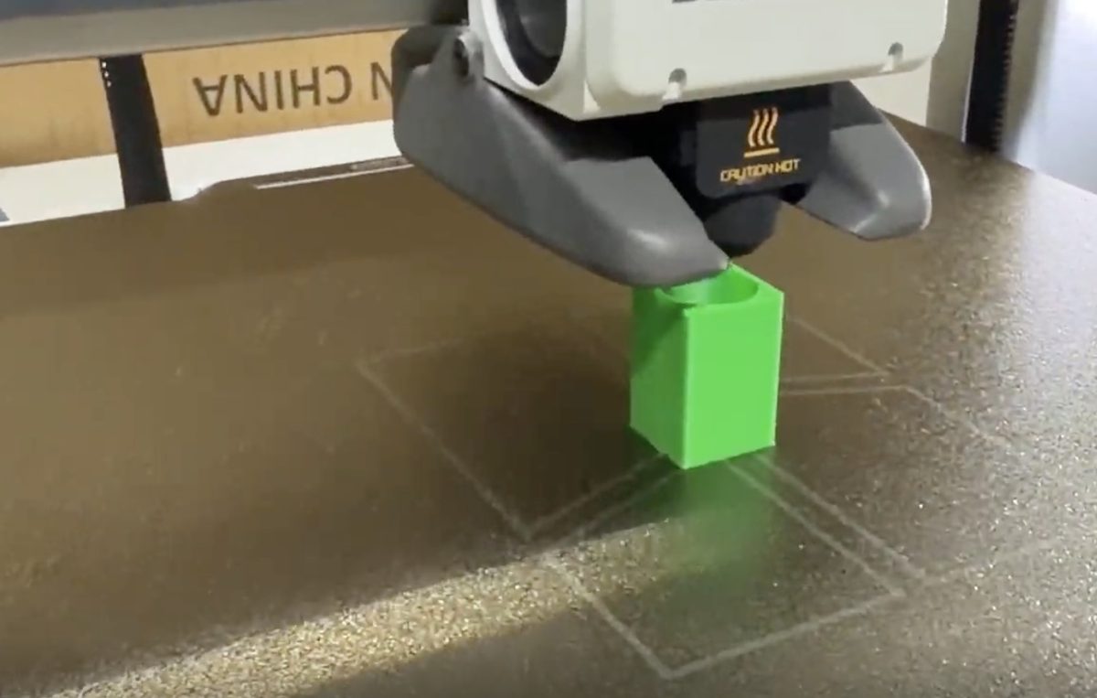 The printed rectangular prism with a cylindrical hole