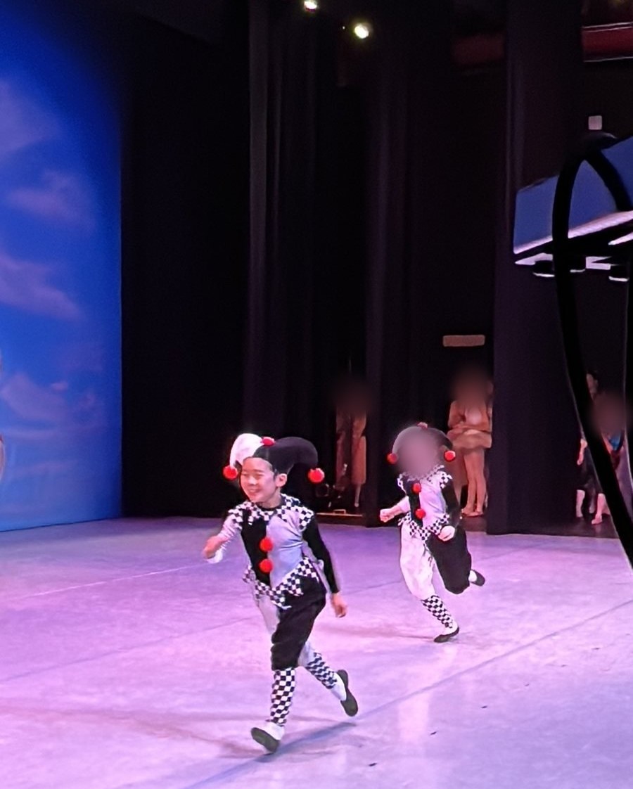 Jian running onto the stage as a Clown, 2022