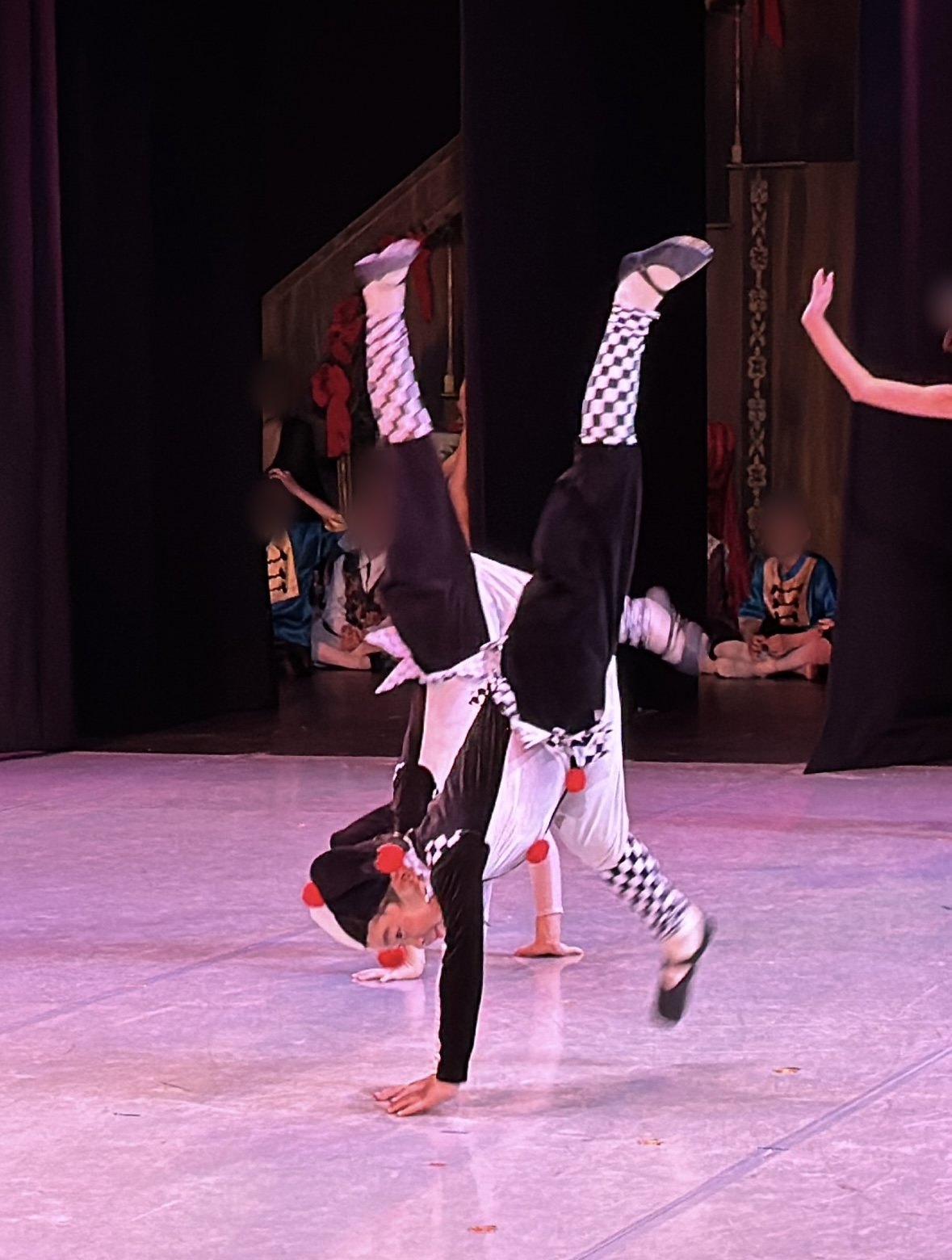 Jian cartwheeling on stage as a Clown, 2023