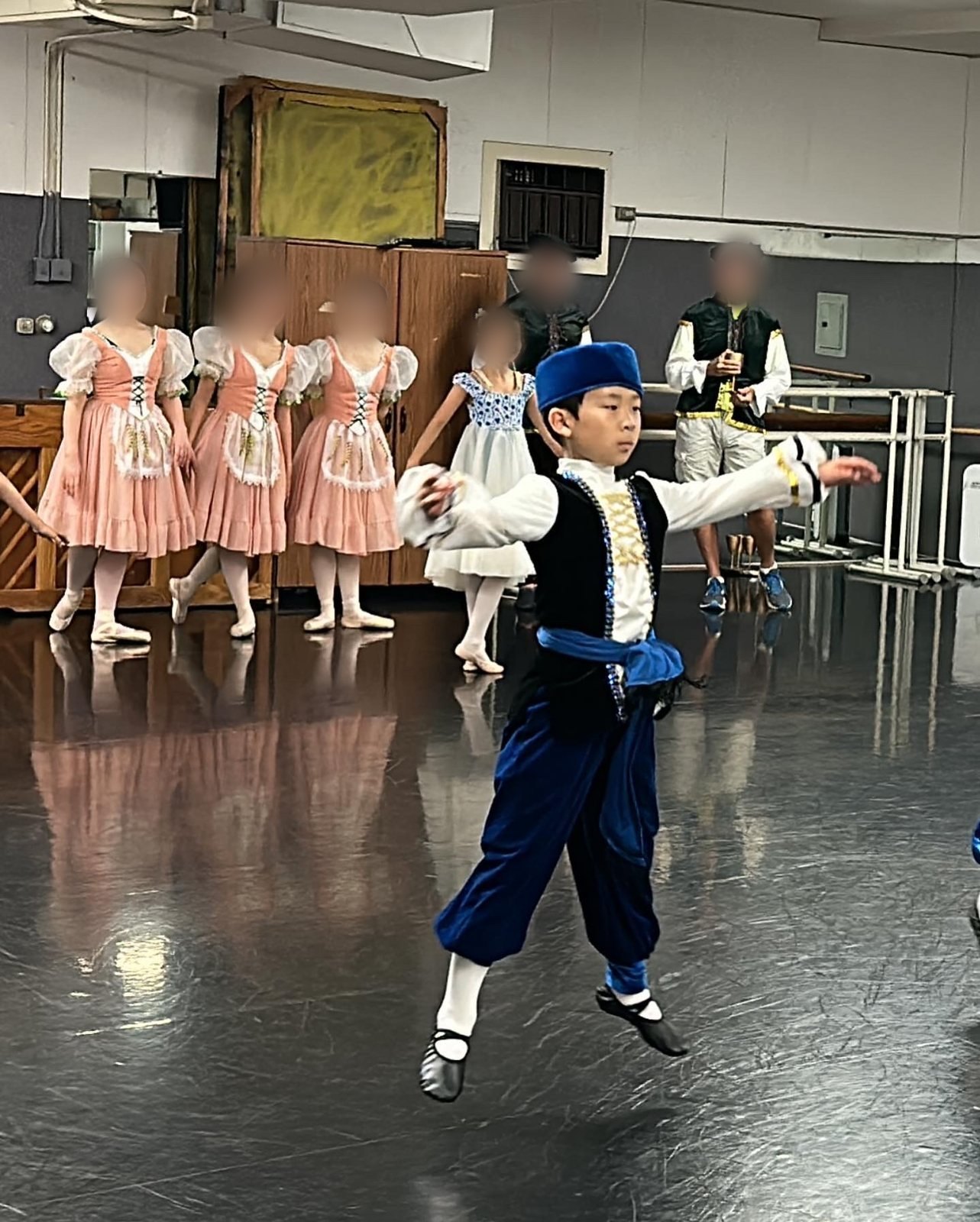 Jian jumping during a costume rehearsal in the studio