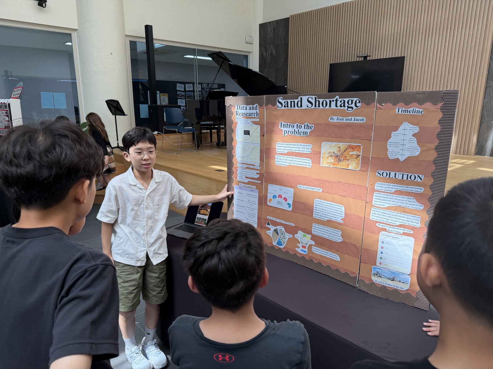 Jian presenting the Sand Shortage board